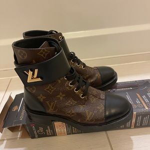 ranger boot, accessorized with the LV Twist buckle iconic Monogram canvas.